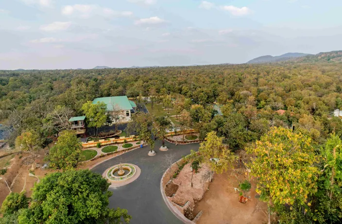 Aerial view of the resort driveway and cottages at Palash Jungle Resort