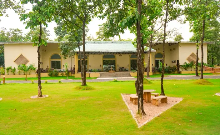 Green lawn and trees in front of the resort building