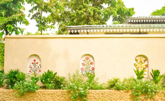 Ornate resort wall with painted floral niches