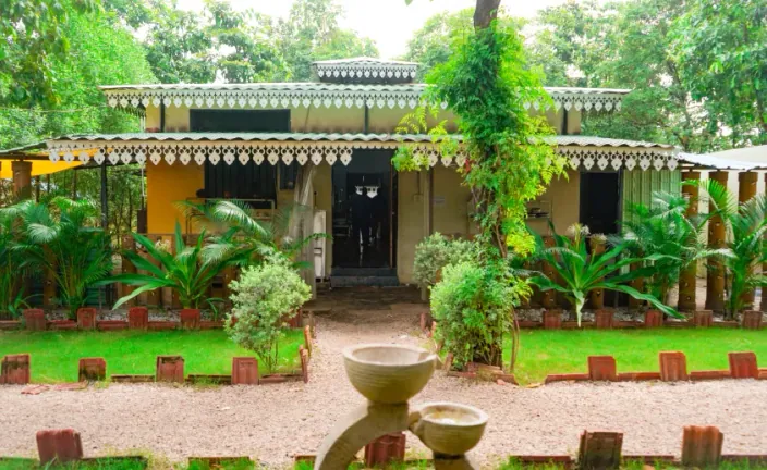 Cottage entrance with a garden at Palash Jungle Resort
