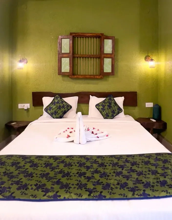 Bedroom with a decorated bed and handcrafted decor