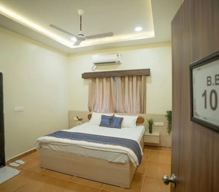 Deluxe room with a king-size bed at Palash Jungle Resort