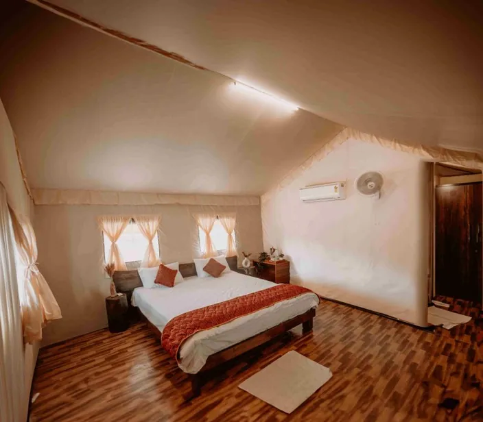 Deluxe room with a king-size bed and framed artwork