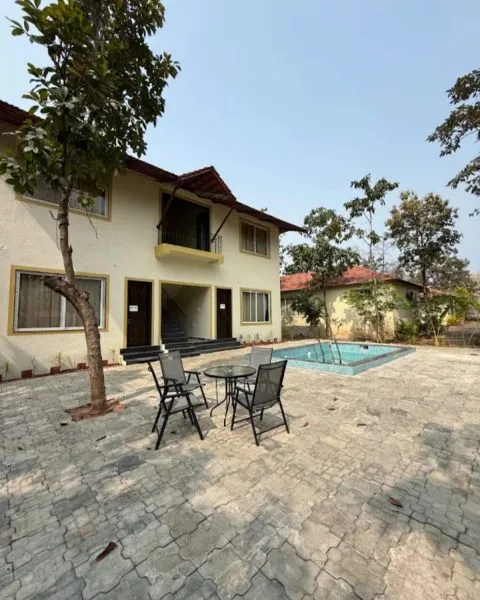 Two-storey private villa with a pool and seating area